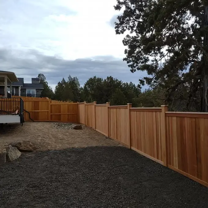 Fence along a gravel yard
